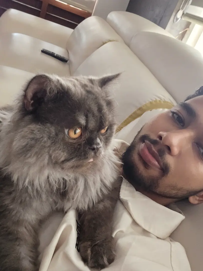 Ameen Abdullah, creative developer, with his cat